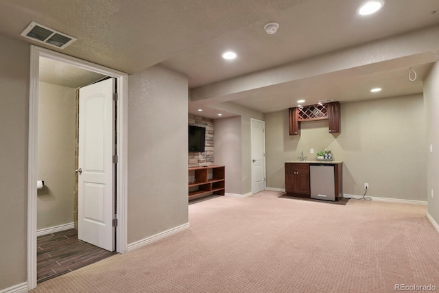 bar with recessed lighting, baseboards, fridge, visible vents, and wet bar