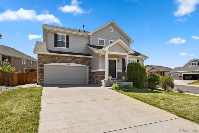 craftsman inspired home with an attached garage, stone siding, fence, a front lawn, and driveway
