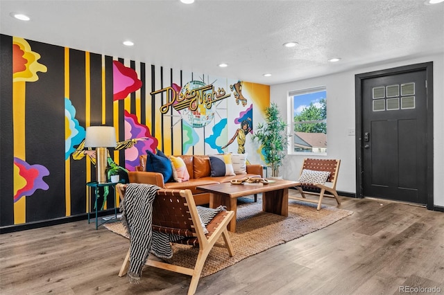 3275 W Hawthorne Pl, Denver, CO 80221 - living room with wood finished floors, recessed lighting, and a textured ceiling
