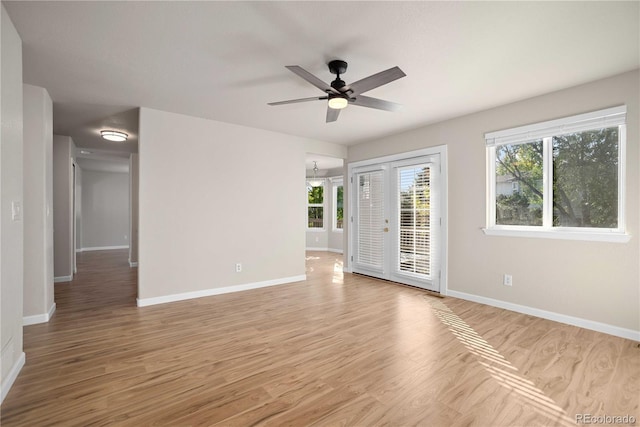 empty room with light hardwood / wood-style floors and ceiling fan