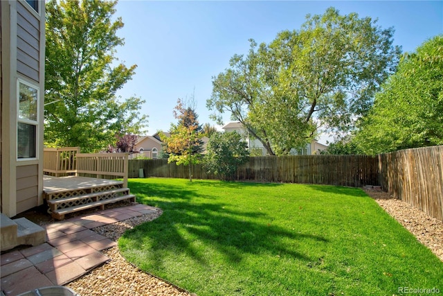 view of yard featuring a deck