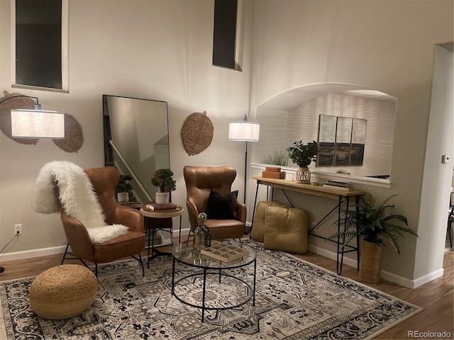 sitting room with hardwood / wood-style floors