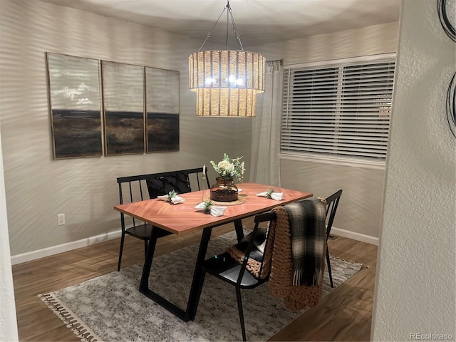 dining space featuring wood-type flooring