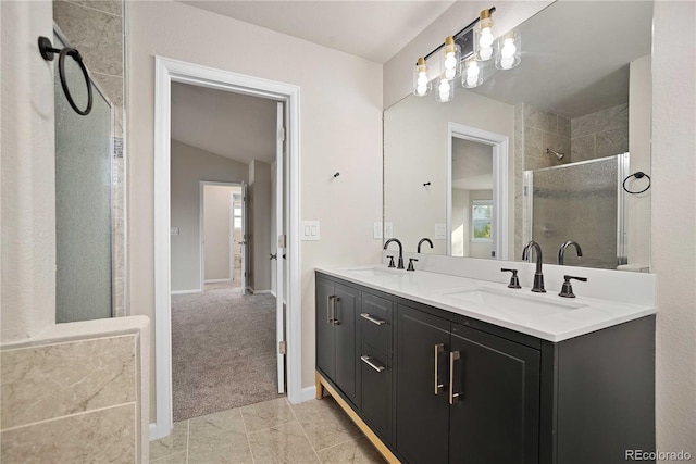 bathroom with an enclosed shower, vanity, and tile patterned floors