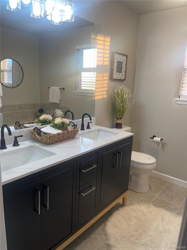 bathroom with tile patterned floors, toilet, and vanity