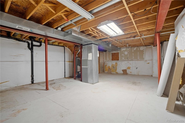 basement featuring gas water heater