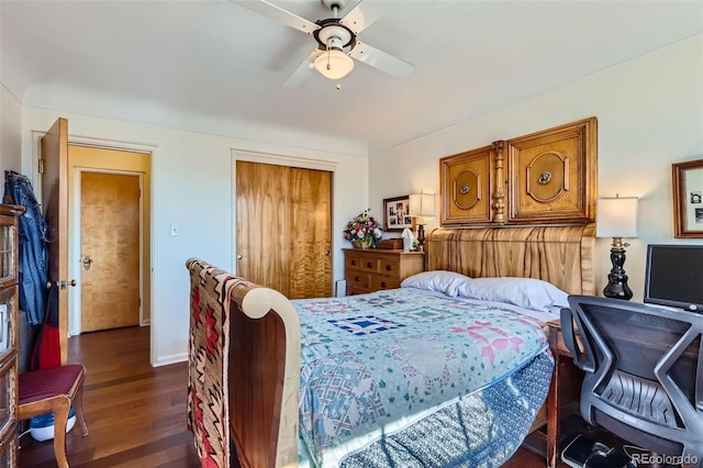 bedroom featuring ceiling fan, a closet, baseboards, and dark wood-style floors