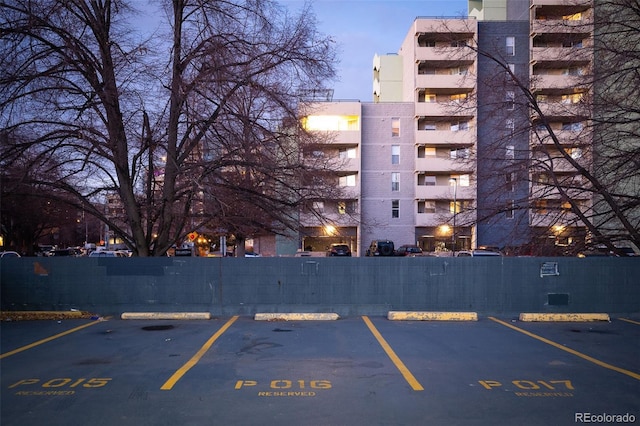 view of parking at dusk