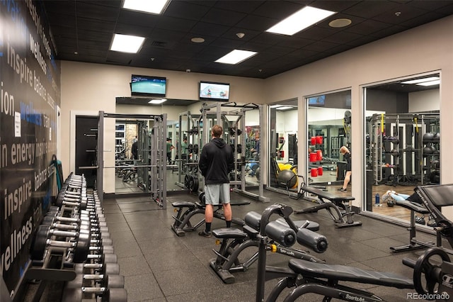 workout area with a paneled ceiling