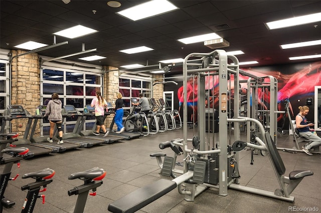 gym featuring a drop ceiling