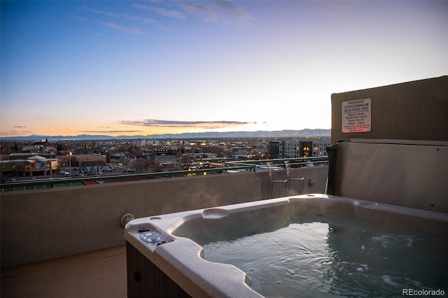 view of pool at dusk