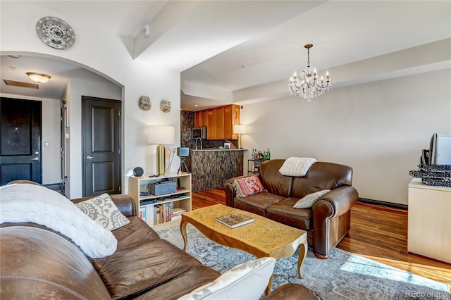 925 N Lincoln St Unit 14C, Denver, CO 80203 - living area with wood finished floors, a chandelier, and arched walkways