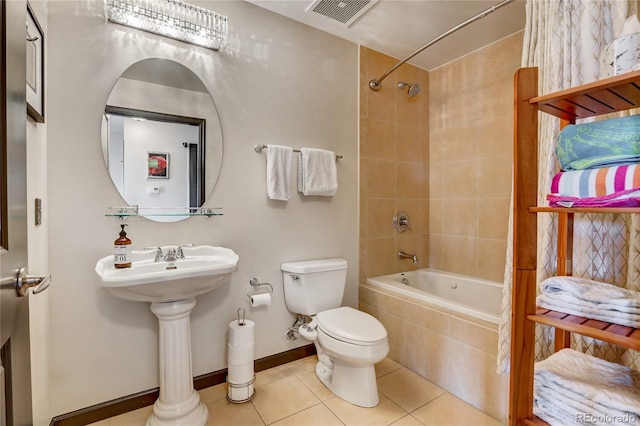 925 N Lincoln St Unit 14C, Denver, CO 80203 - full bathroom with tiled shower / bath, toilet, tile patterned flooring, baseboards, and a sink