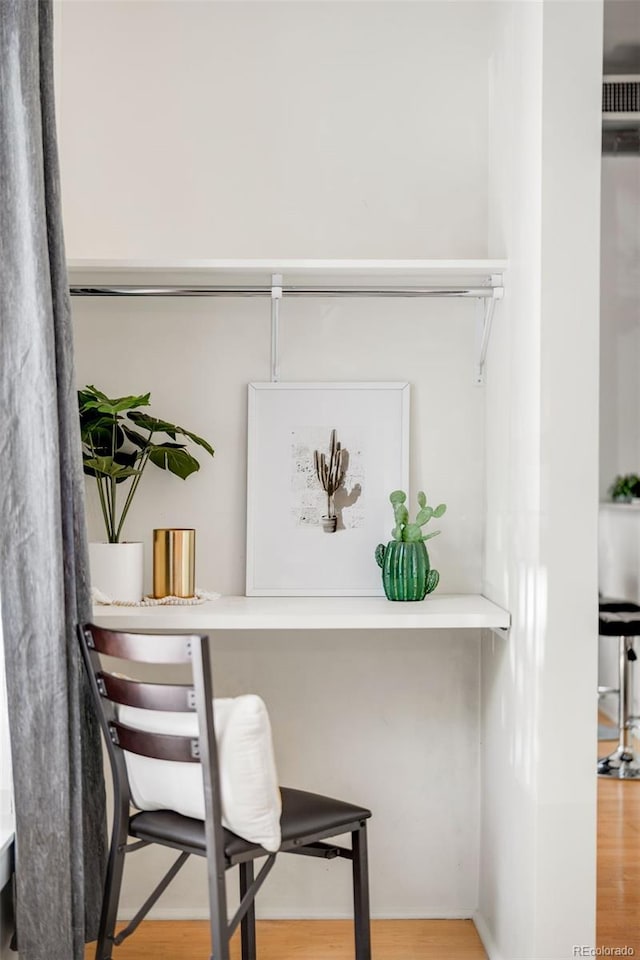interior space with visible vents and wood finished floors