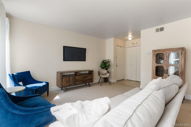 living room featuring light carpet