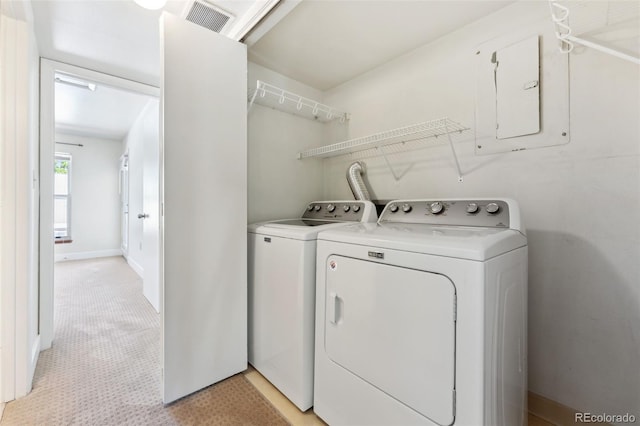 laundry room with separate washer and dryer