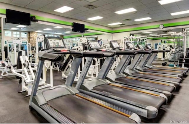 exercise room featuring a drop ceiling