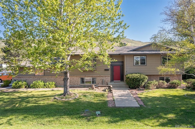 15000 W 29th Ave, Golden, CO 80401 - view of front of property featuring brick siding and a front lawn