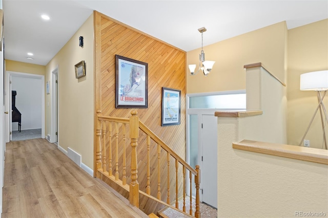 15000 W 29th Ave, Golden, CO 80401 - corridor with an upstairs landing, wood walls, an accent wall, recessed lighting, and baseboards