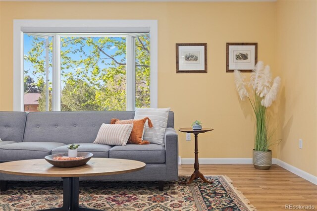 15000 W 29th Ave, Golden, CO 80401 - sitting room with wood finished floors, baseboards, and healthy amount of natural light