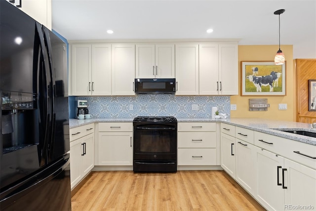 15000 W 29th Ave, Golden, CO 80401 - kitchen featuring black appliances, white cabinetry, backsplash, light wood-style floors, and recessed lighting
