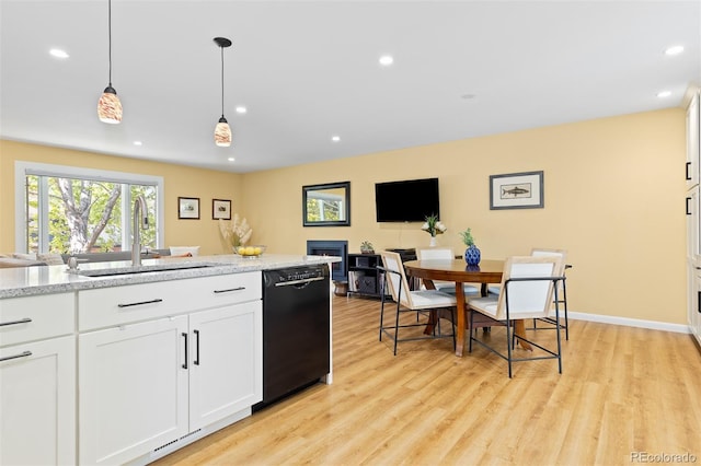 15000 W 29th Ave, Golden, CO 80401 - kitchen featuring black dishwasher, a sink, light wood-type flooring, recessed lighting, and white cabinetry
