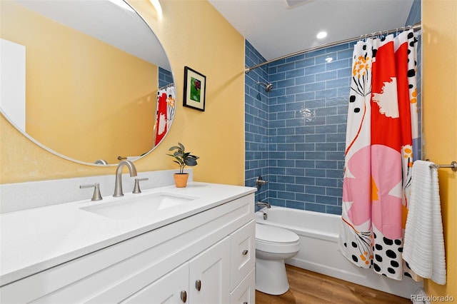15000 W 29th Ave, Golden, CO 80401 - full bathroom with wood finished floors, toilet, shower / tub combo with curtain, vanity, and recessed lighting