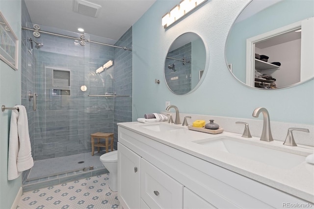 15000 W 29th Ave, Golden, CO 80401 - full bath featuring a stall shower, double vanity, and toilet