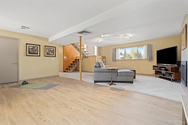15000 W 29th Ave, Golden, CO 80401 - living area with stairway, wood finished floors, track lighting, and baseboards