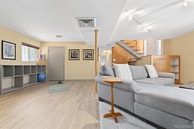15000 W 29th Ave, Golden, CO 80401 - living area with track lighting, light wood finished floors, stairs, and baseboards