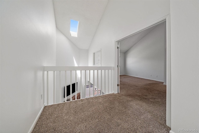 4246 S Granby St Unit B, Aurora, CO 80014 - hall featuring carpet floors, high vaulted ceiling, and a skylight