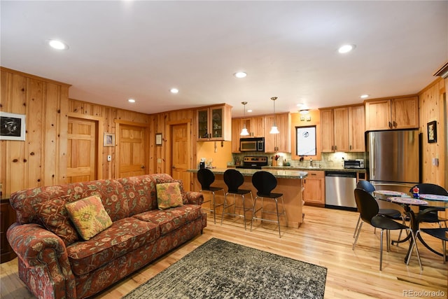 446 Blue River Rd, Breckenridge, CO 80424 - living room with light wood-style flooring, recessed lighting, and wood walls