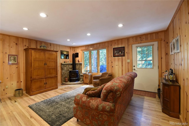 446 Blue River Rd, Breckenridge, CO 80424 - living room featuring a wood stove, wooden walls, healthy amount of natural light, light wood-type flooring, and recessed lighting