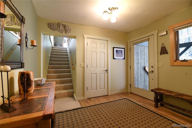 446 Blue River Rd, Breckenridge, CO 80424 - entryway featuring light wood finished floors and stairway