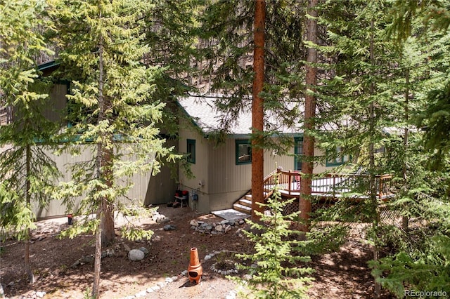 446 Blue River Rd, Breckenridge, CO 80424 - view of property exterior with roof with shingles and a wooden deck