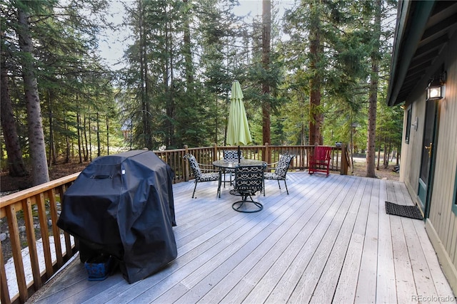 446 Blue River Rd, Breckenridge, CO 80424 - wooden terrace featuring outdoor dining area and a grill