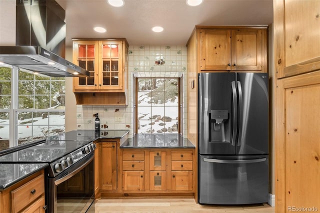 6530 Ridgeview Dr, Morrison, CO 80465 - kitchen with stainless steel refrigerator with ice dispenser, wall chimney range hood, black electric range oven, recessed lighting, and decorative backsplash