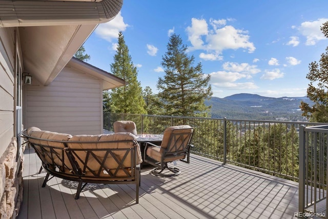 6530 Ridgeview Dr, Morrison, CO 80465 - wooden terrace featuring a mountain view and an outdoor living space
