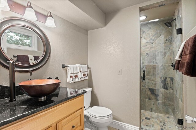 6530 Ridgeview Dr, Morrison, CO 80465 - bathroom with a shower stall, toilet, vanity, and baseboards