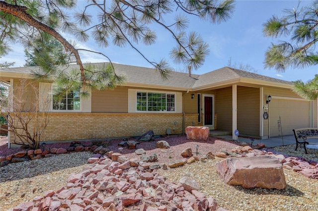 single story home with a garage