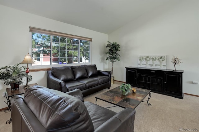 carpeted living room with vaulted ceiling