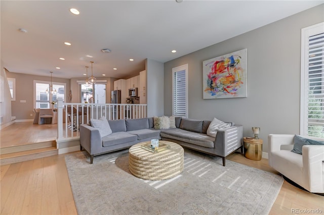 living room with light hardwood / wood-style flooring