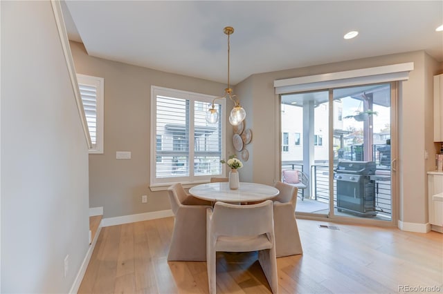 dining room featuring light hardwood / wood-style flooring