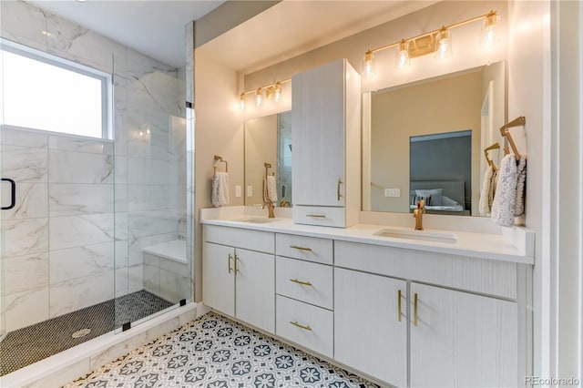 bathroom with an enclosed shower and vanity