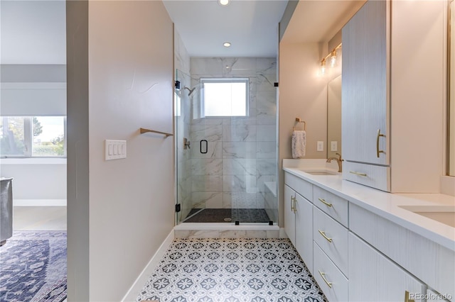 bathroom featuring walk in shower and vanity