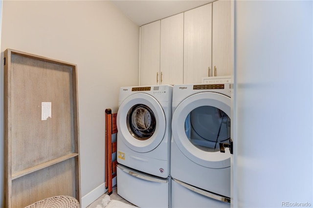 laundry area featuring cabinets and independent washer and dryer