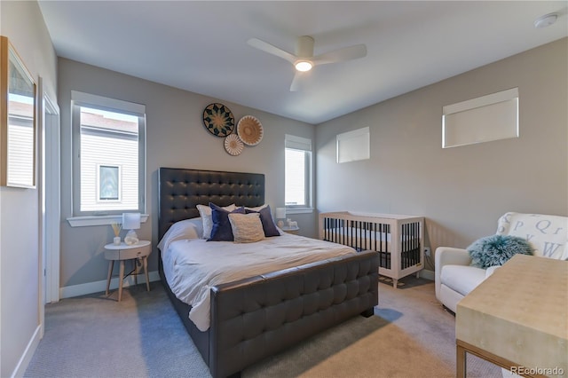 carpeted bedroom with ceiling fan