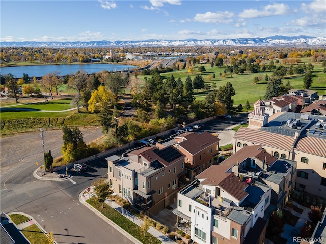 birds eye view of property with a water and mountain view