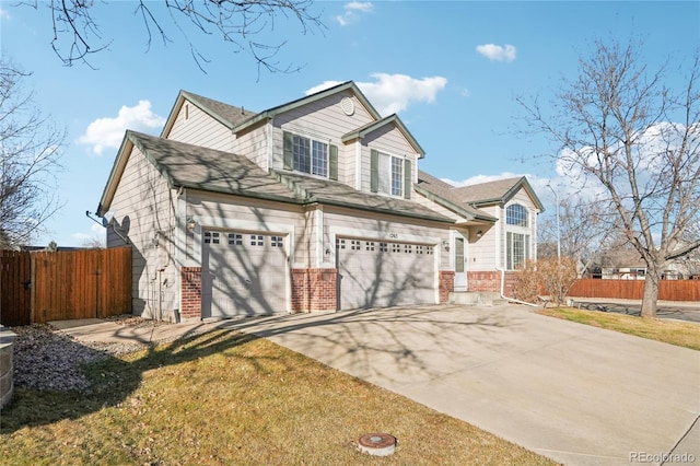 view of front of home with a front yard and a garage