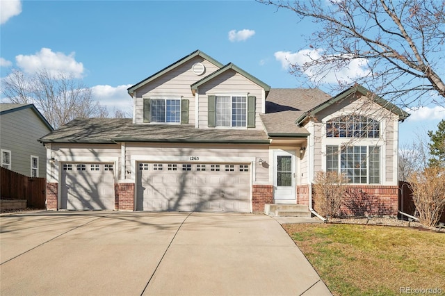 view of front facade featuring a garage and a front lawn